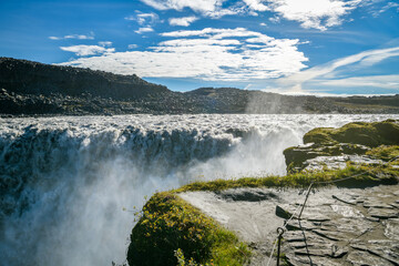 On the edge of Detifoss waterfall in Iceland