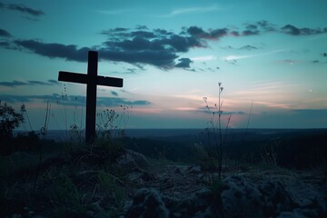 A silhouette of a cross at twilight, presenting a powerful symbol against the backdrop of a tranquil and contemplative sky.

