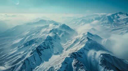 Aerial photo with a view of snow-capped mountains. Snow-covered beautiful mountains, covered with...