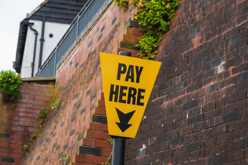 Car park pay here sign, on street parking signpost