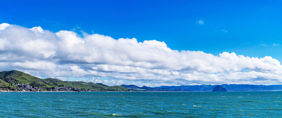 Panorama of ocean, coast with sky, clouds, 