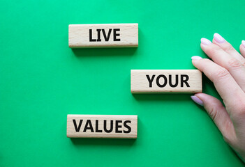 Live your values symbol. Concept words Live your values on wooden blocks. Beautiful green...