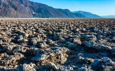 Self-sedimented salt cracked in the heat of the sun in the desert in Death Valley, Death Valley...