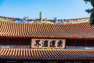 Fototapeta na wymiar The Dragon and Pagoda on the roof of the main hall of Kaiyuan Temple in Quanzhou, Fujian, China