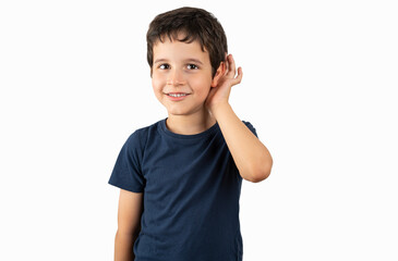 Child over isolated background smiling with hand over ear listening an hearing to rumor or gossip. Deafness concept.