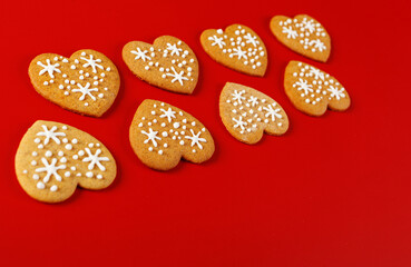beautiful hand-baked cookies in the shape of a heart on a red background