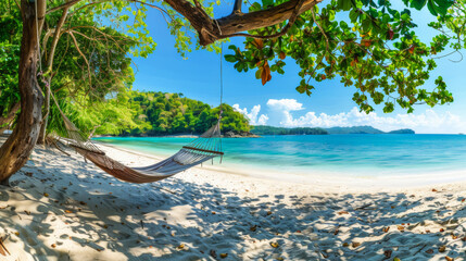 Tropical beach background. Beach hammock hangs on a palm tree over golden sand, calm sea or ocean and sunny sky. Paradisaic delight. Vacation or vacation concept. - obrazy, fototapety, plakaty