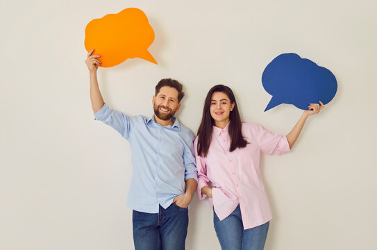 Young happy couple, paper speech balloons above, man, woman pair happy communication, dialog. People interact, information, express feeling, good conversation, discourse, chatting in close relations
