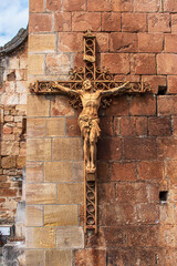 Sculpture of Jesus Christ crucified on his cross - 783338874