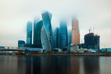 Fototapeta na wymiar Moscow, Russia - November 3, 20209: Heights in the fog. Buildings of the business center Moscow City in a cityscape.