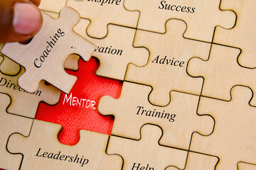 Business concept image of Jigsaw puzzle pieces with word  Mentoring