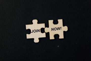 Jigsaw puzzle pieces with word JOIN NOW Business concept