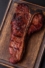 Delicious juicy beef tbone steak with salt, spices and herbs