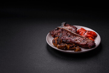 Delicious juicy beef tbone steak with salt, spices and herbs