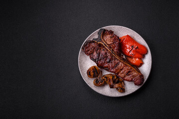 Delicious juicy beef tbone steak with salt, spices and herbs