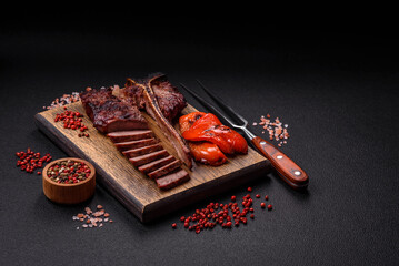 Delicious juicy beef tbone steak with salt, spices and herbs
