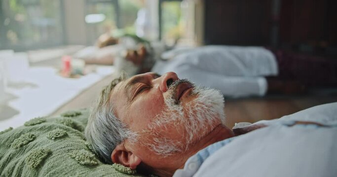 Senior man, relax and sleeping with pillow for zen, health and wellness on wooden floor at home. Calm or elderly male person asleep in comfort, peace or tranquility on soft cushion in therapy room