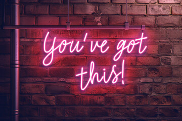 "You've got this!" Sign In Neon Lights on the dark brick wall. motivational phrase written with pink neon lights on a brick wall. ai-generated