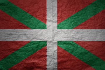 big national flag of basque country on a grunge old paper texture background