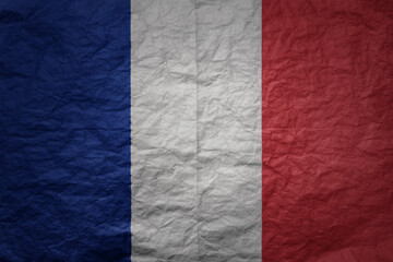 big national flag of france on a grunge old paper texture background