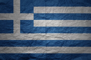 big national flag of greece on a grunge old paper texture background