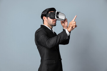 Project manager with virtual reality glasses looking at data analysis while analyzing and pointing data. Skilled business man using VR goggle and digital innovation while enter metaverse. Deviation.