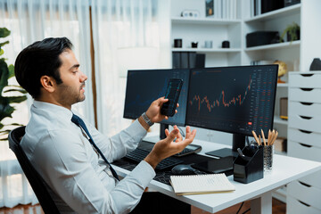 Trader businessman searching on smartphone, analyzing in dynamic stock exchange investment screen...