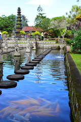 BALI ISLAND - INDONESIA  18.06.2022: Hindu Balinese Water Palace Tirta Gangga with statues of the gods, fountains on Bali island, Indonesia