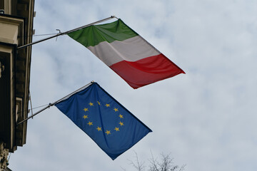 The Italian Embassy. The Italian and European Union flags are next to each other on the facade of the historic building. A symbol of patriotism and independence. Serbia, Belgrade - 03.22.2024.
