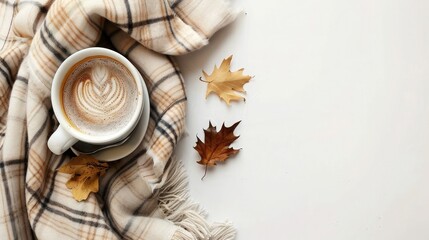 Flat lay plaid and cup of coffee on white desk. Hygge, autumn cozy mood, comfort concept. Flat lay, top view