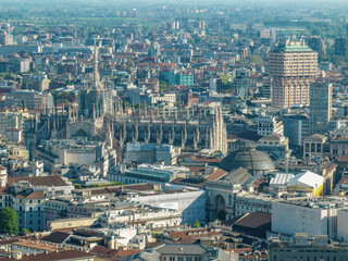 Aerial view of the Milan Cathedral. Duomo di Milano. Cathedral in white marble. Buttresses, pinnacles and spiers. Statue of the Madonnina. Lombardia. 04-12-2024. Italy - 783377058