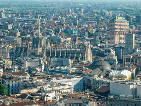 Aerial view of the Milan Cathedral. Duomo di Milano. Cathedral in white marble. Buttresses, pinnacles and spiers. Statue of the Madonnina. Lombardia. 04-12-2024. Italy