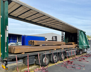 Transportation of wave metal slate in a semi-trailer. Semi-trailer with metal slate