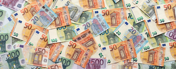 Many european euro money bills. Lot of banknotes of european union currency close up