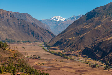 Sacred Valley of the Inca and Urubamba River with snowcapped Andes mountain peak, Cusco, Peru.