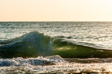 Small powerful wave breaking at the shore - 2