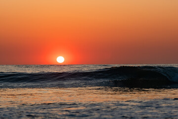 Sunset with small wave