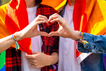 Gay people joining hand to form heart shape