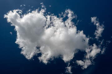 Beautiful sky view. White clouds on a blue background.	
