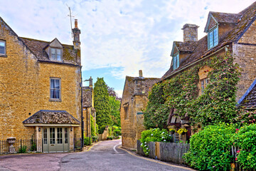 Beautiful architecture of a charming Cotswolds village at dusk, Gloucestershire, England