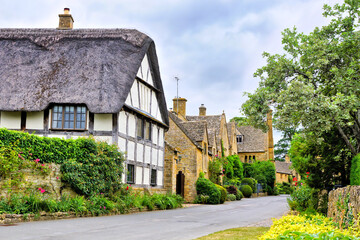 Beautiful Cotswolds village with half timbered thatched roof house, Stanton, Gloucestershire, England