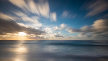 abstract motion blur background of the sea with blue sky and clouds