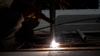 Metalwork craftsman use tool sparkle repair melt welding with steel light fire equipment workshop...