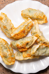 top view dish of fried dumplings at vertical composition