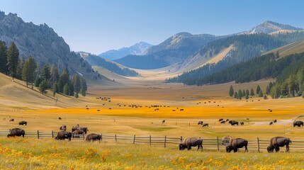   A herd of wild animals grazes on a lush green field, framed by mountain ranges sporting yellow wildflowers in the foreground