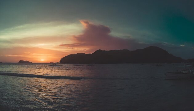 panoramic view on beautiful colorful sunset over sea phillipines islands