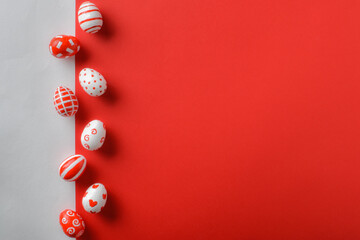 Easter backgrounds, a strip of Easter red and white eggs on a white-red background. Copy space....