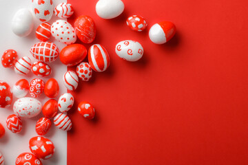 Easter backgrounds, geometric Easter red and white eggs on a white-red background. Copy space. Flat lay, top view