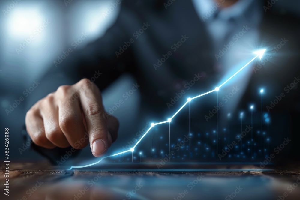 Poster a man is pointing at a graph that shows a rising line