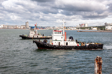 Two tugboats waiting to provide service in the port of Mar del Plata